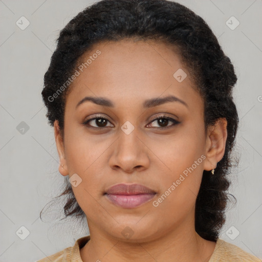 Joyful black young-adult female with long  brown hair and brown eyes