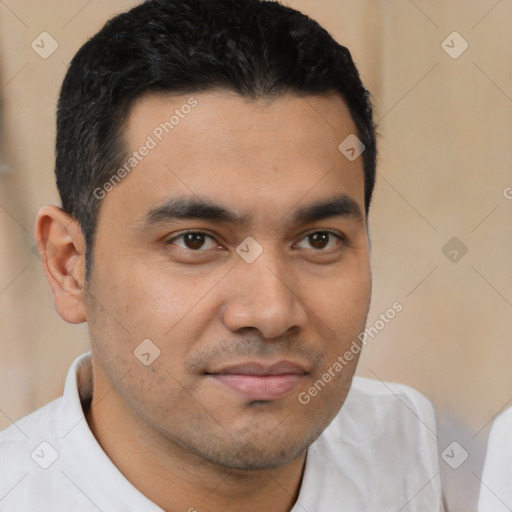 Joyful latino young-adult male with short  brown hair and brown eyes