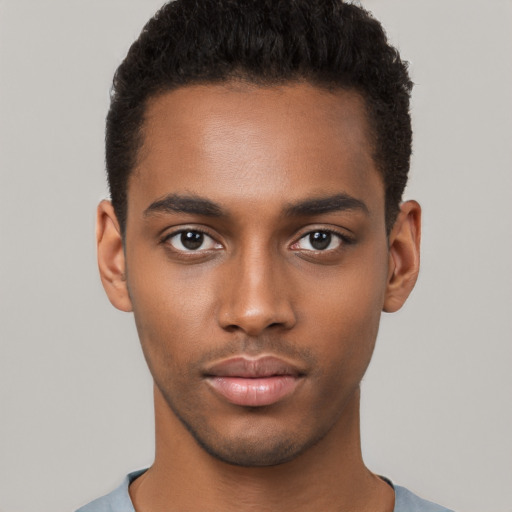 Neutral black young-adult male with short  black hair and brown eyes