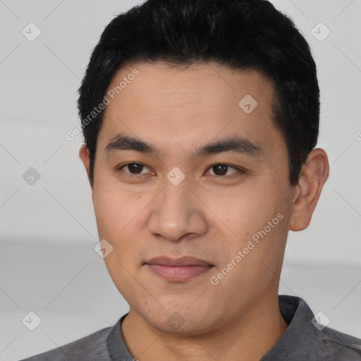 Joyful latino young-adult male with short  black hair and brown eyes