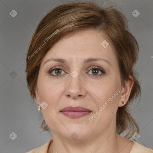 Joyful white adult female with medium  brown hair and grey eyes