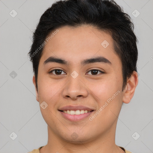 Joyful asian young-adult male with short  brown hair and brown eyes