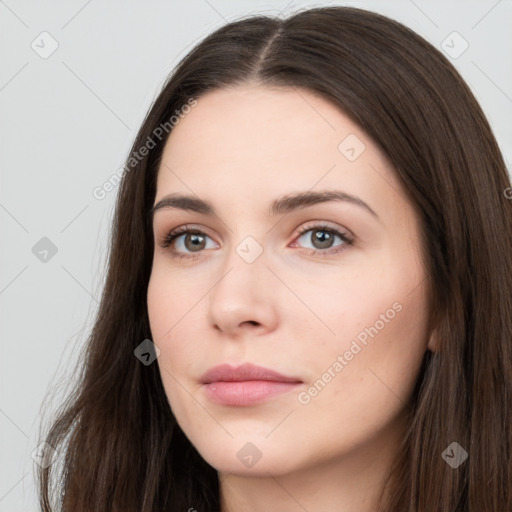 Neutral white young-adult female with long  brown hair and brown eyes