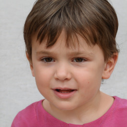 Joyful white child male with short  brown hair and brown eyes