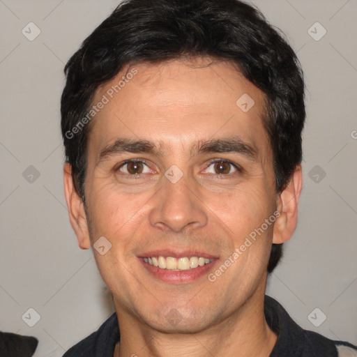 Joyful white adult male with short  black hair and brown eyes