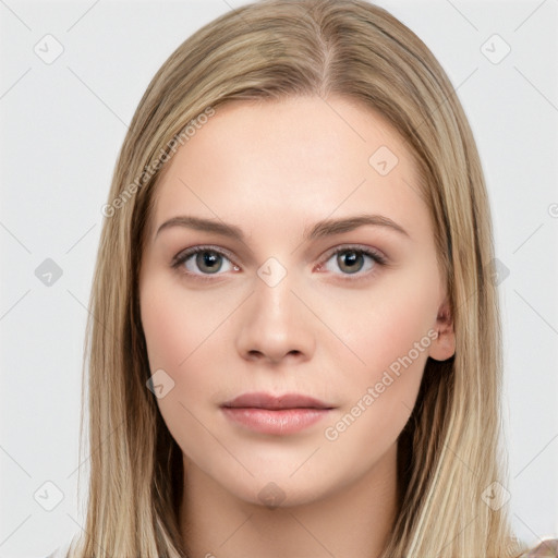 Neutral white young-adult female with long  brown hair and brown eyes