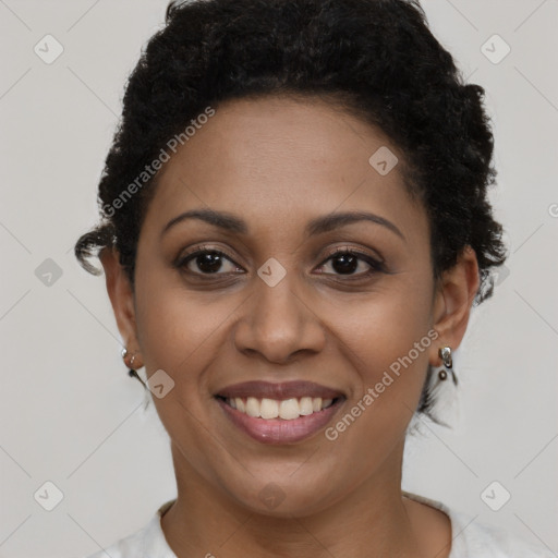 Joyful black young-adult female with short  brown hair and brown eyes