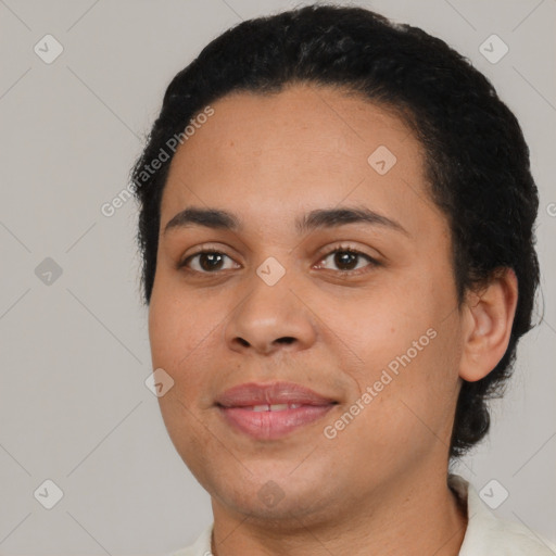 Joyful latino young-adult female with short  black hair and brown eyes