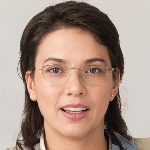 Joyful white adult female with medium  brown hair and grey eyes