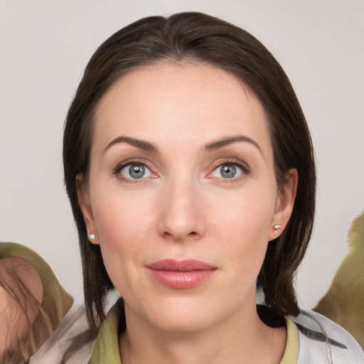 Neutral white young-adult female with medium  brown hair and grey eyes