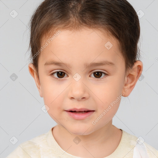 Joyful white child female with short  brown hair and brown eyes