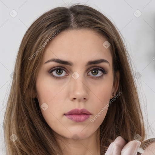 Neutral white young-adult female with long  brown hair and brown eyes