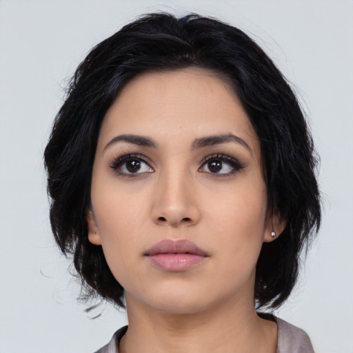 Neutral asian young-adult female with medium  black hair and brown eyes