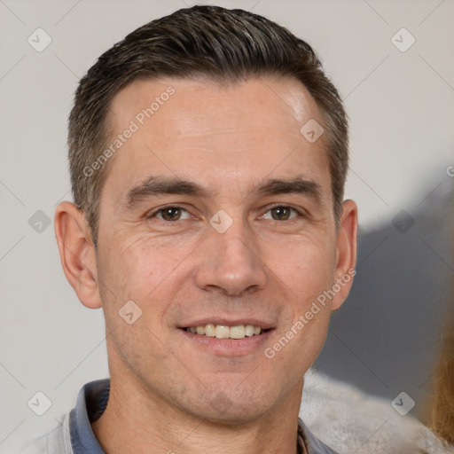 Joyful white adult male with short  brown hair and brown eyes