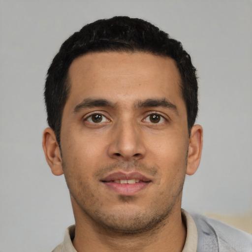 Neutral latino young-adult male with short  black hair and brown eyes