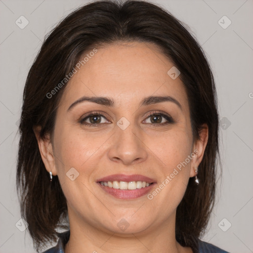 Joyful white adult female with medium  brown hair and brown eyes