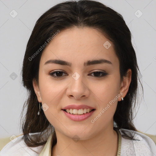 Joyful latino young-adult female with medium  brown hair and brown eyes