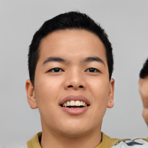Joyful asian young-adult male with short  black hair and brown eyes