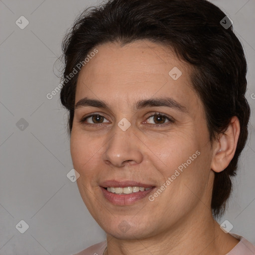 Joyful white adult female with medium  brown hair and brown eyes