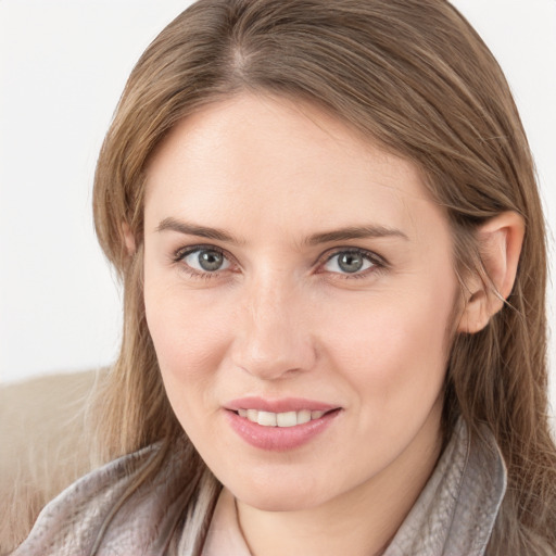 Joyful white young-adult female with long  brown hair and grey eyes