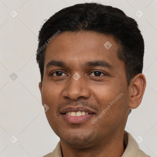 Joyful latino young-adult male with short  black hair and brown eyes