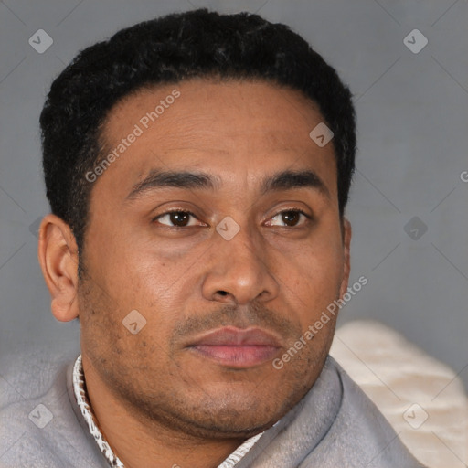 Neutral latino young-adult male with short  brown hair and brown eyes