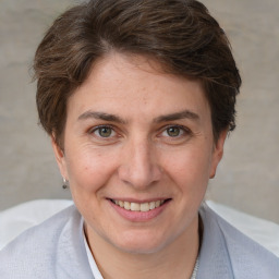 Joyful white adult female with short  brown hair and brown eyes