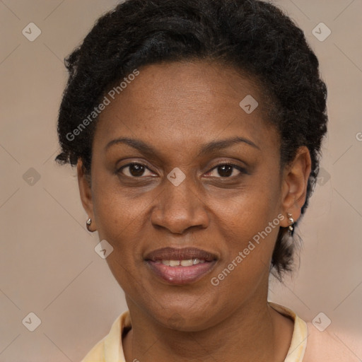 Joyful black adult female with short  brown hair and brown eyes