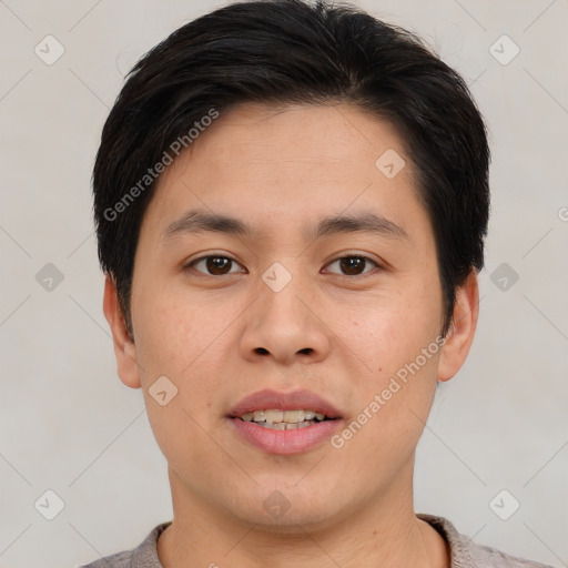 Joyful asian young-adult male with short  brown hair and brown eyes