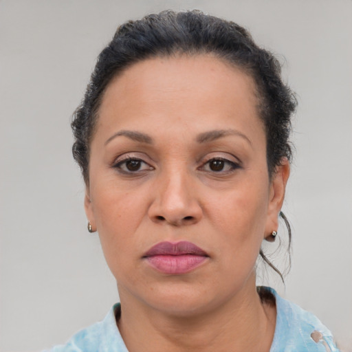 Joyful black adult female with short  brown hair and brown eyes