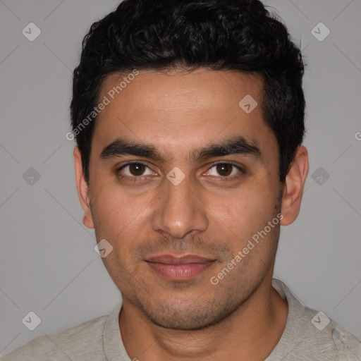 Joyful latino young-adult male with short  black hair and brown eyes