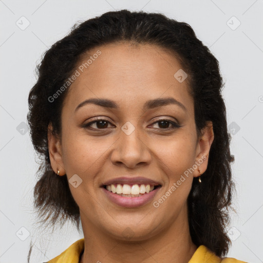 Joyful latino young-adult female with long  brown hair and brown eyes