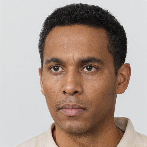 Neutral black young-adult male with short  black hair and brown eyes