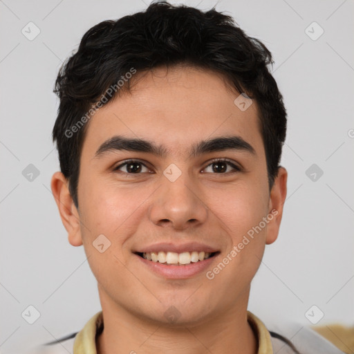 Joyful latino young-adult male with short  brown hair and brown eyes