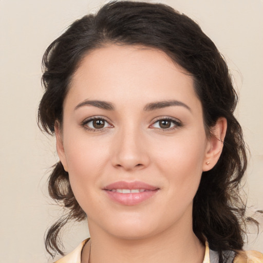 Joyful white young-adult female with medium  brown hair and brown eyes