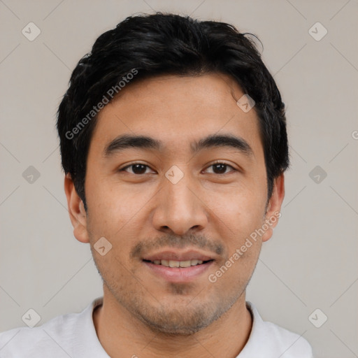 Joyful latino young-adult male with short  black hair and brown eyes