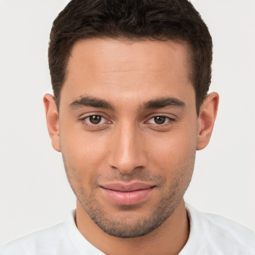 Joyful white young-adult male with short  brown hair and brown eyes