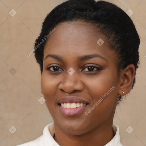 Joyful black young-adult female with short  brown hair and brown eyes