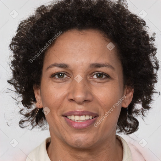 Joyful black adult female with medium  brown hair and brown eyes