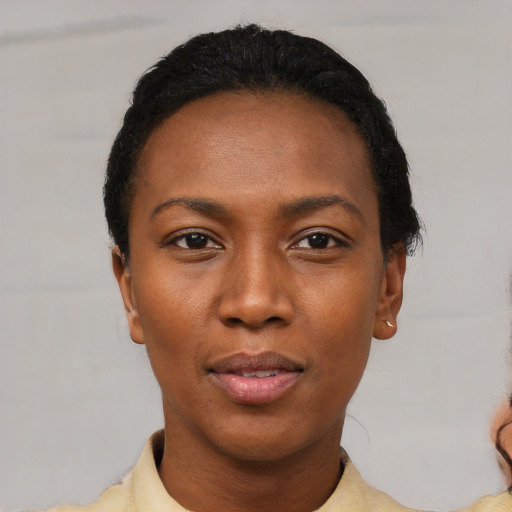 Neutral black young-adult female with short  black hair and brown eyes