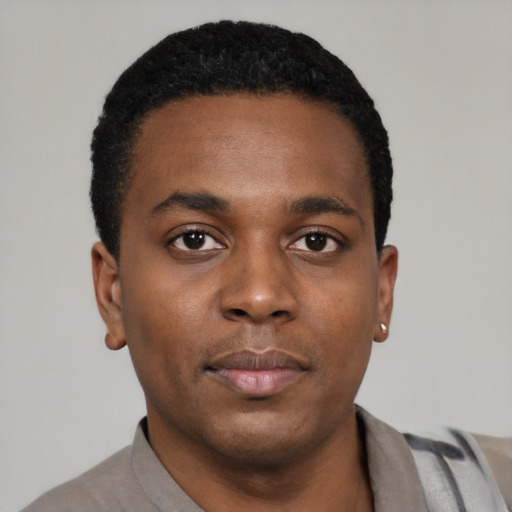 Neutral black young-adult male with short  black hair and brown eyes