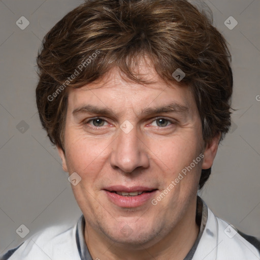 Joyful white adult male with short  brown hair and grey eyes