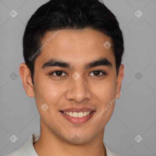 Joyful latino young-adult male with short  brown hair and brown eyes