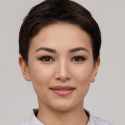 Joyful asian young-adult female with short  brown hair and brown eyes