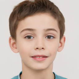 Joyful white child male with short  brown hair and brown eyes