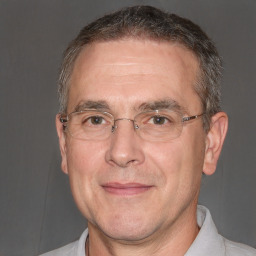 Joyful white middle-aged male with short  brown hair and brown eyes