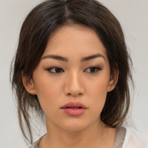 Neutral asian young-adult female with medium  brown hair and brown eyes