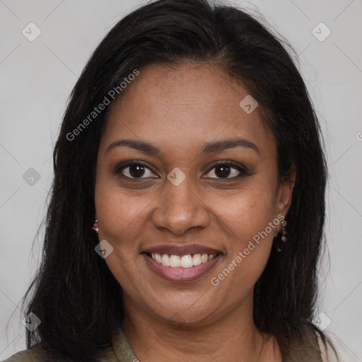 Joyful black young-adult female with long  brown hair and brown eyes