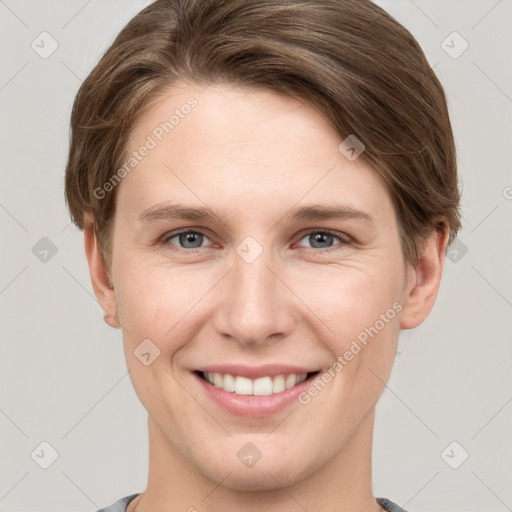 Joyful white young-adult female with short  brown hair and grey eyes