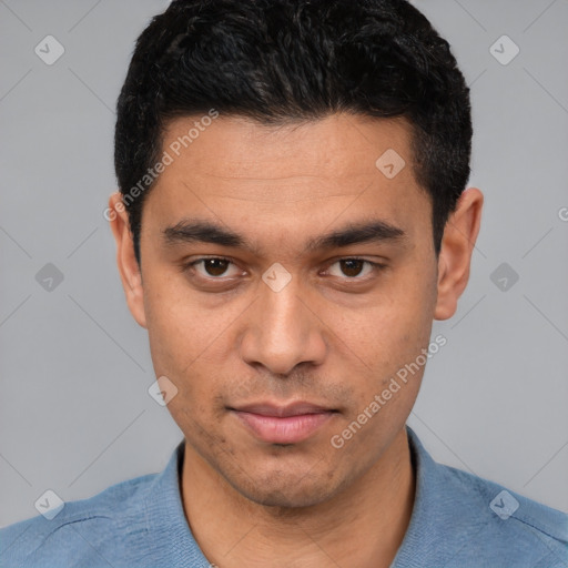 Joyful white young-adult male with short  black hair and brown eyes